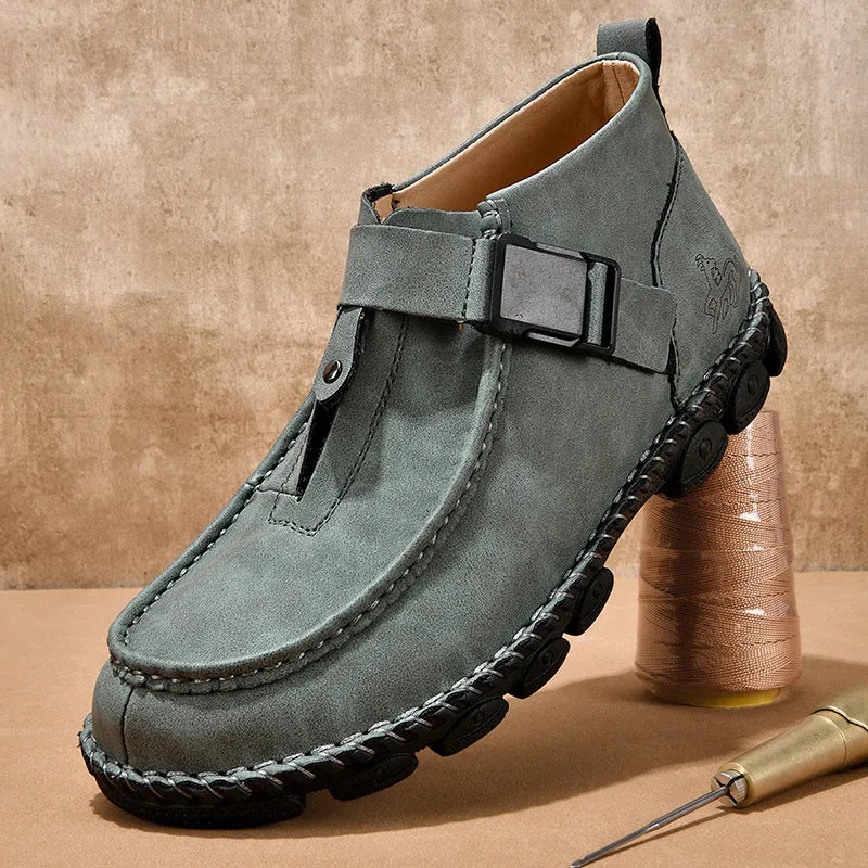Men's black casual slip on loafers with visible stitching and a flat sole.