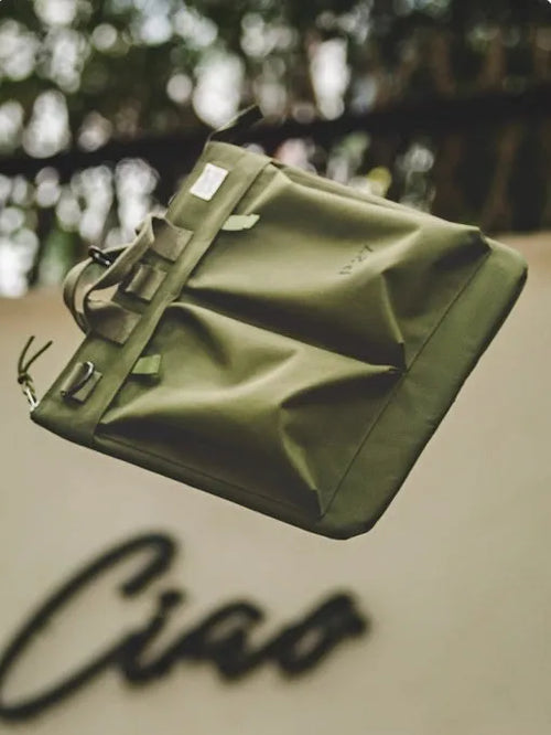 Canvas crossbody shoulder bag in military green with phone pocket and space for 15-inch laptop
