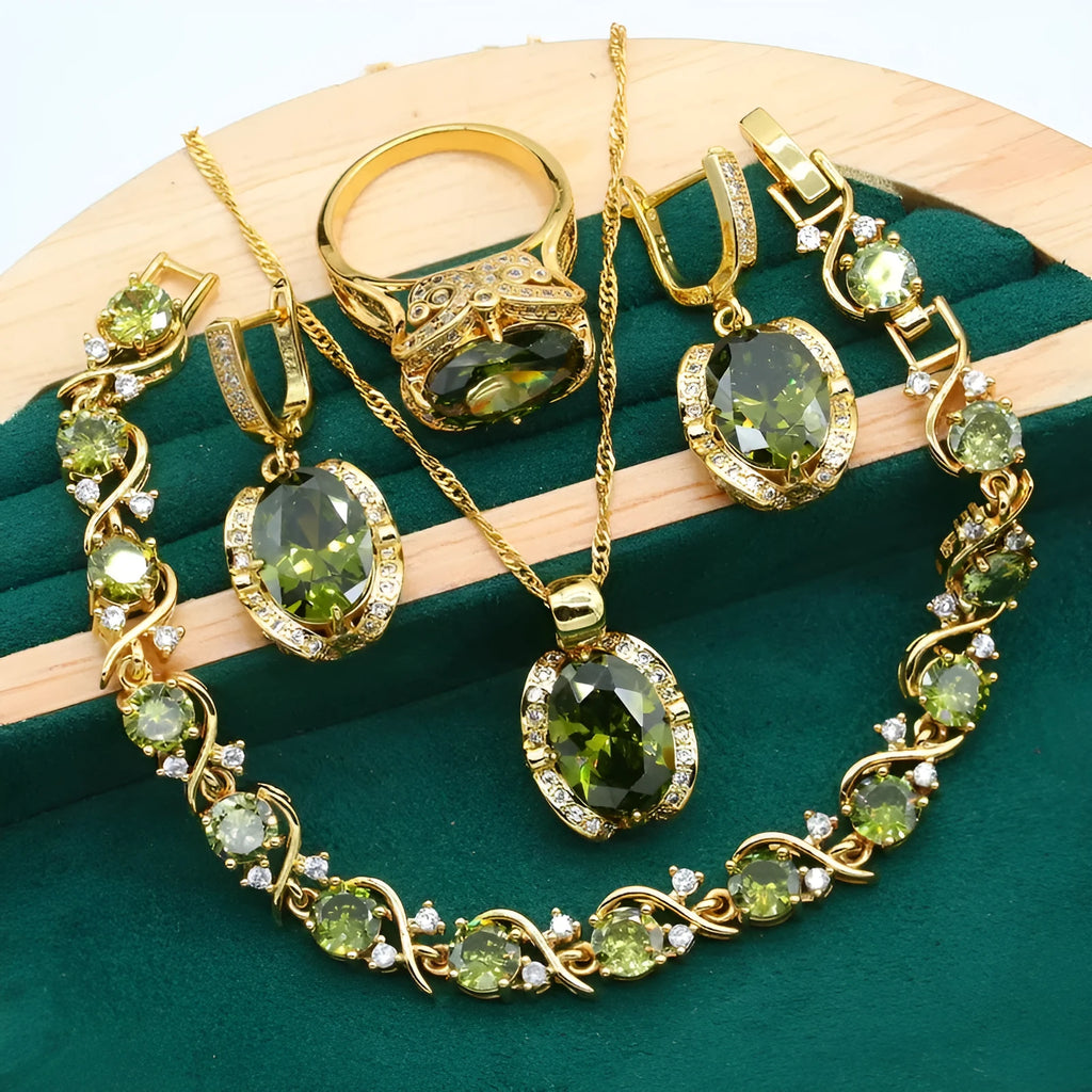 Olive green and red women's jewellery set with zircon stones, snake bone chain necklace, earrings, and ring.