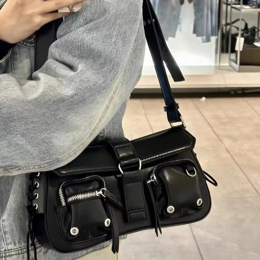 Black structured PU leather women's baguette messenger bag with adjustable long shoulder strap.