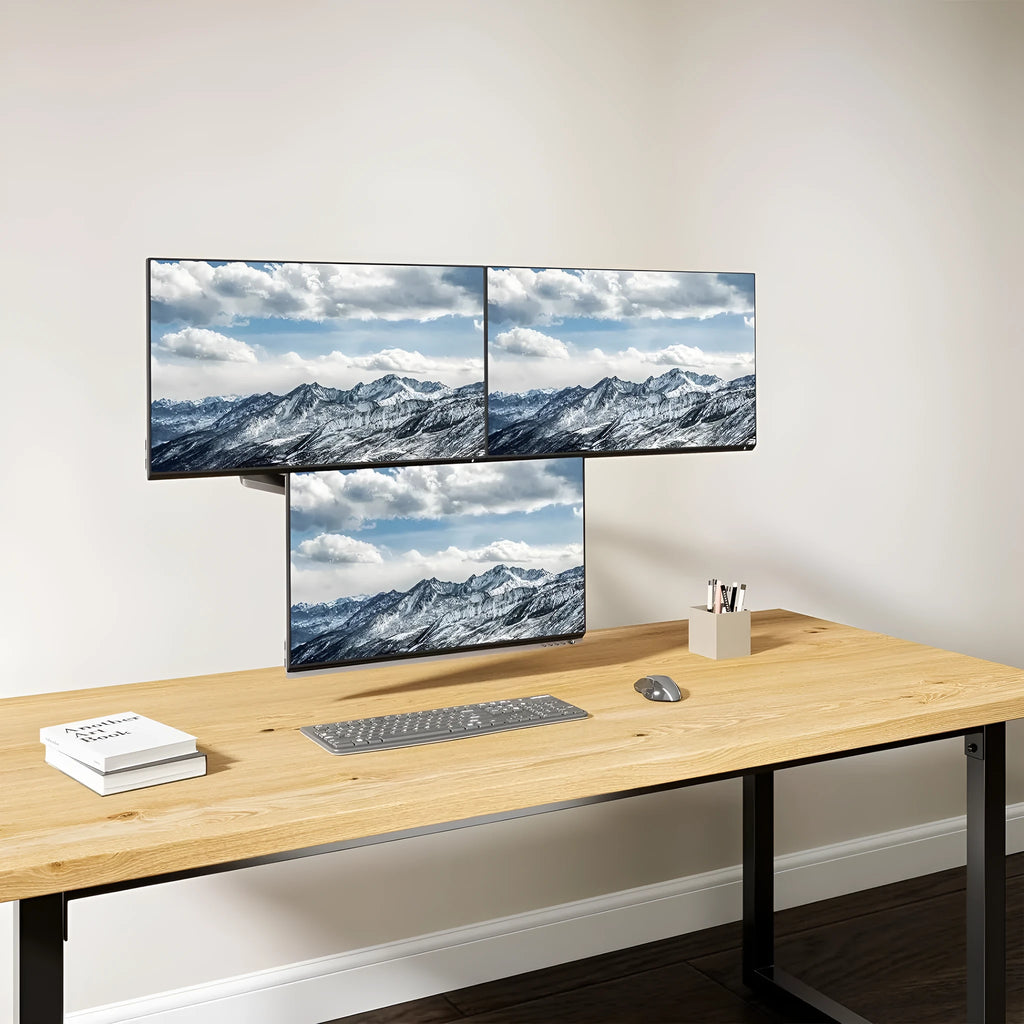 Black gas spring monitor arm with three aluminium arms supporting 27-inch computer screen