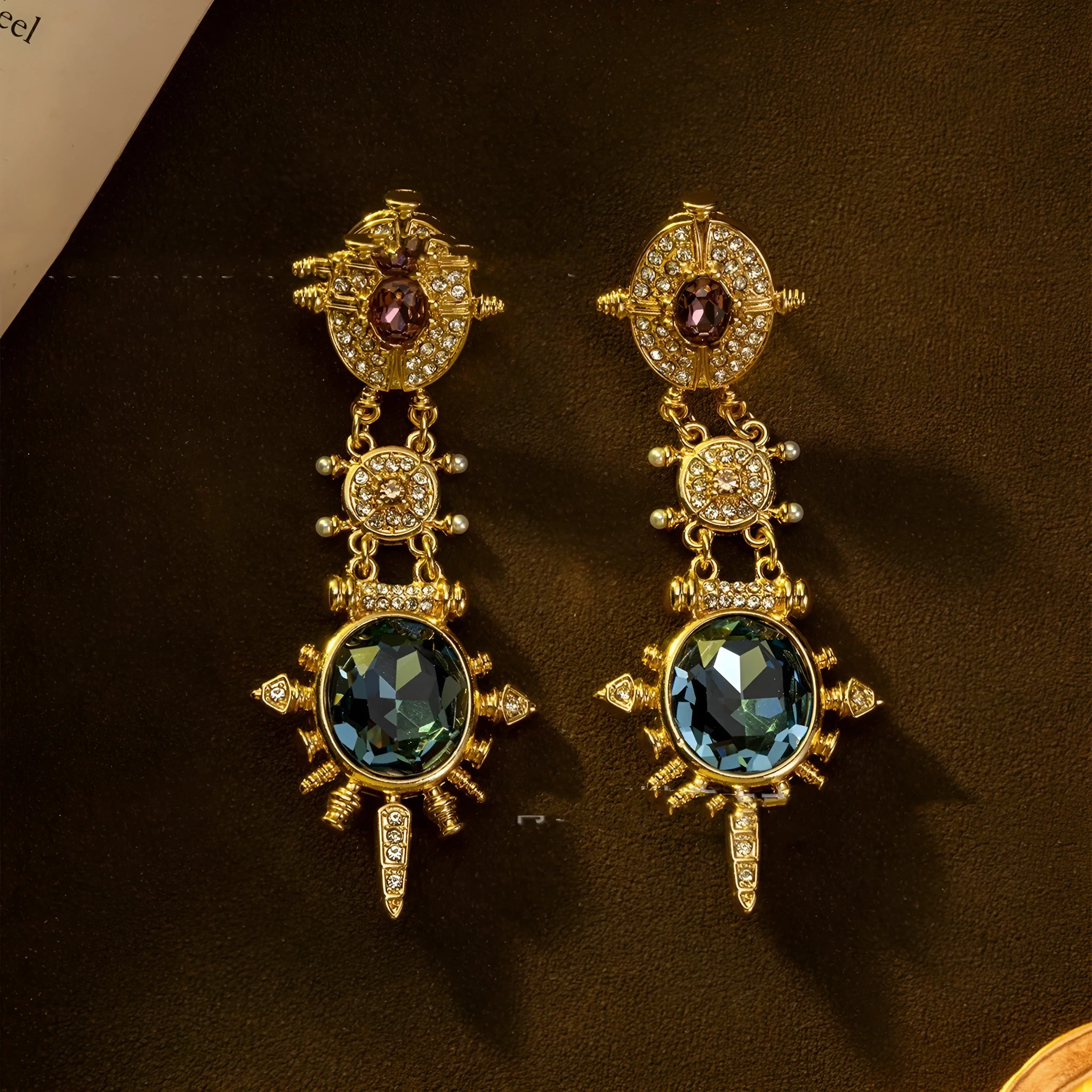 Pair of gold-coloured geometric round stud earrings with retro court style design