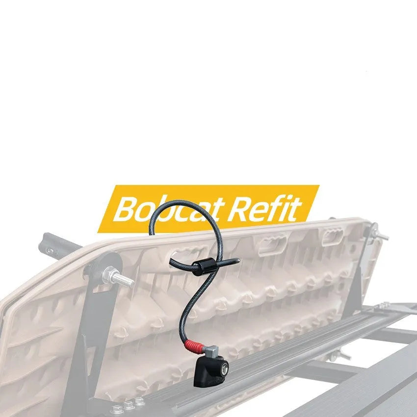 Plastic-sheathed steel cable lock for securing kayak to a vehicle roof rack without drilling.