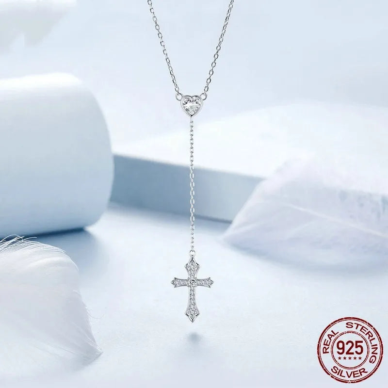 Silver love cross pendant necklace with V-neck chain on woman
