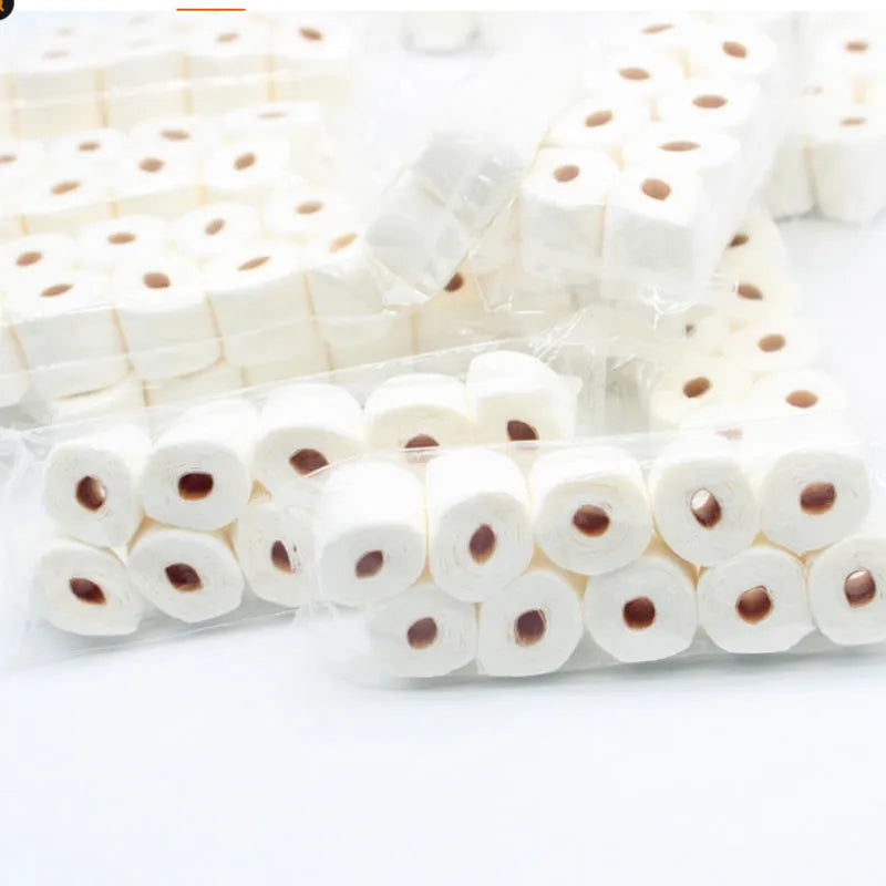 Small paper model of a tissue roll for dollhouse play, measuring 30mm by 15mm by 80mm.