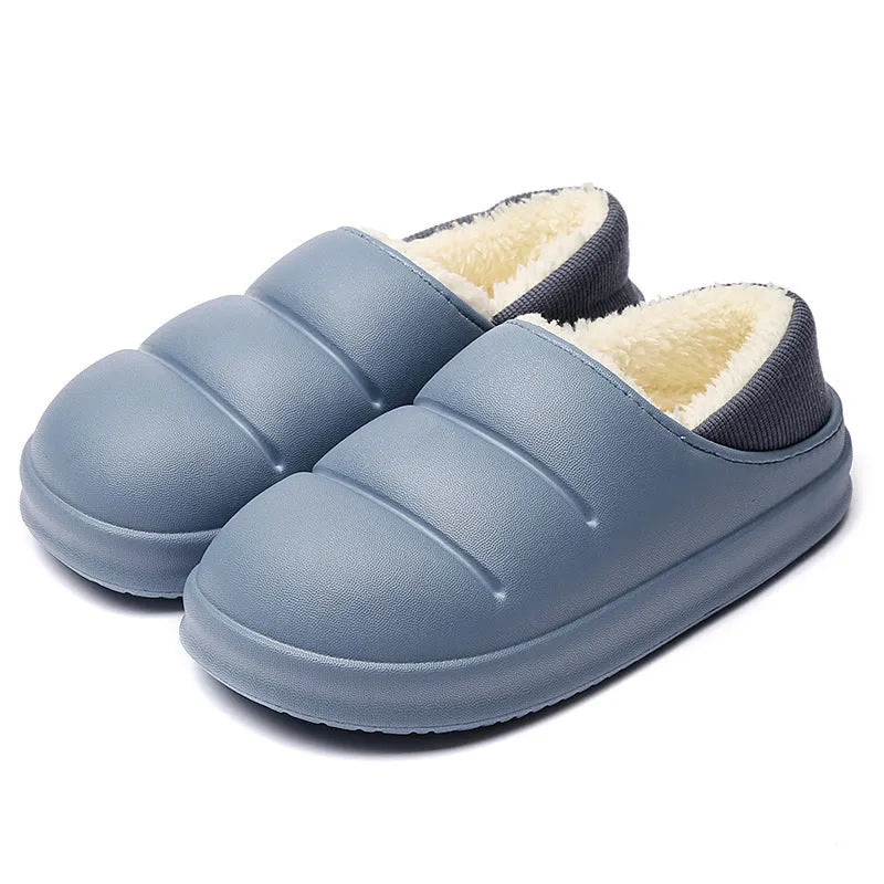 Women's green waterproof EVA winter slippers with plush lining and a non-slip sole.