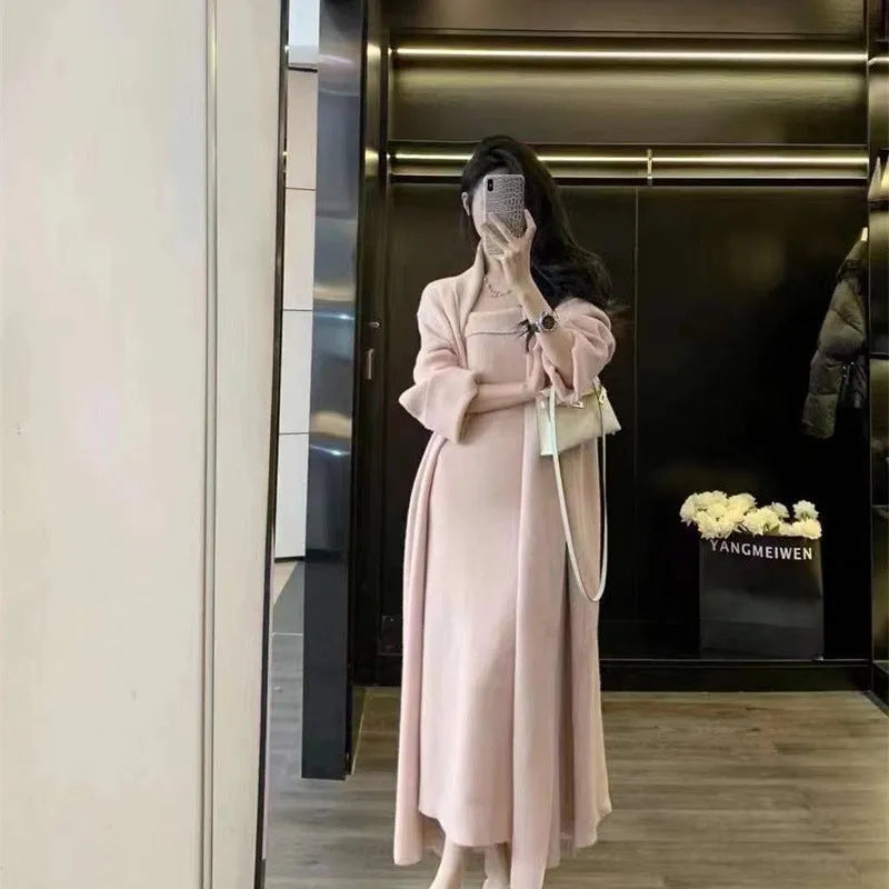 Women's grey knitted cardigan dress sweater suit two piece set with long skirt and regular sleeves.