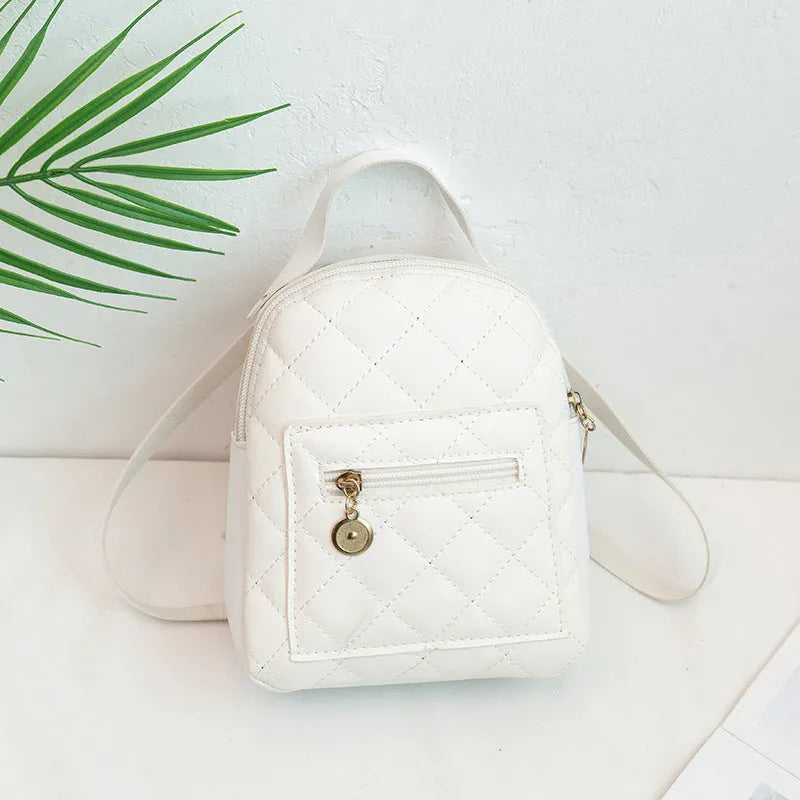 Girls' hard shell backpack with embroidery in black, pink, or white colours showing square shape and sandwich pocket
