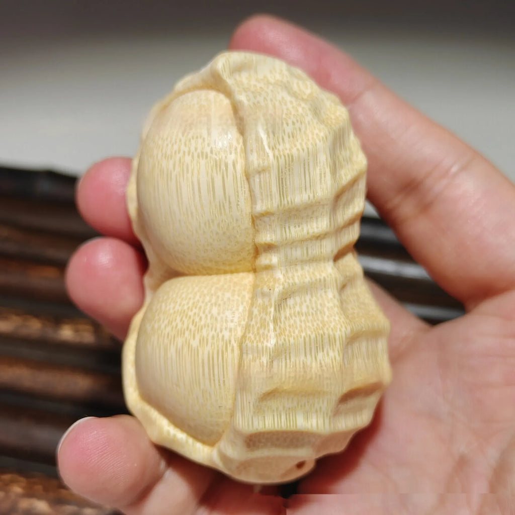 Solid bamboo carving peanut ornament with natural finish and modern simplicity design