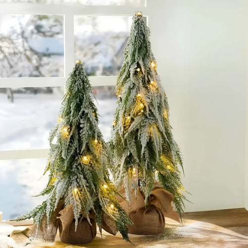 24-inch artificial Christmas tree with white snow finish and built-in LED lights on branches