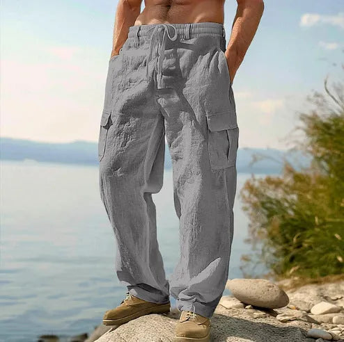 Man wearing loose-fitting, solid-colour cotton wide-leg casual trousers.