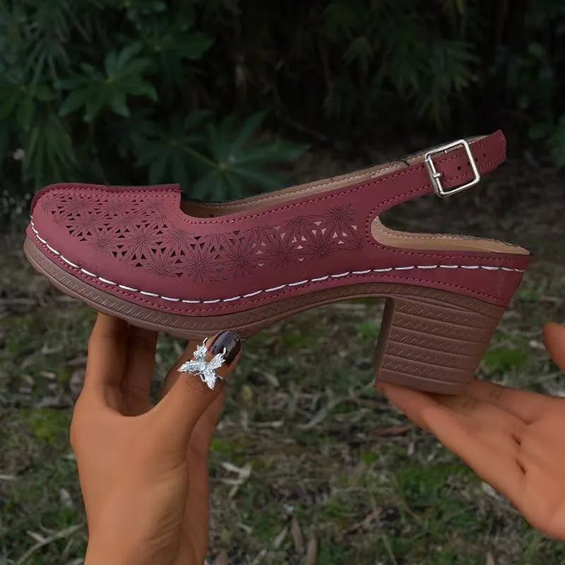 Women's closed toe wedge sandal in PU leather with a round toe and rubber wedge sole.