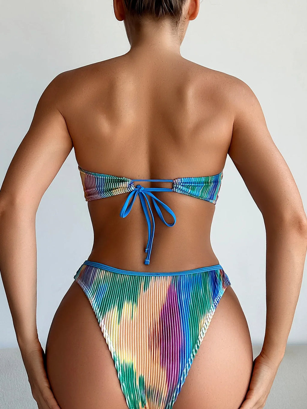 Colour printed two-piece bikini set with a tube top and briefs on a mannequin.