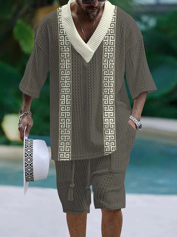 Loose casual short sleeve suit two-piece set in polyester fabric, showing top and shorts.
