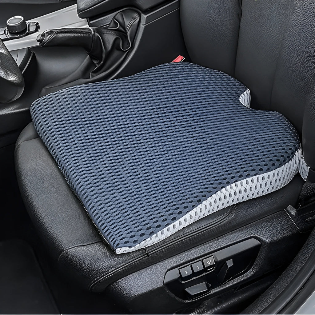 Regular size memory foam seat cushion with a black strap, shown in a creamy white solid colour.