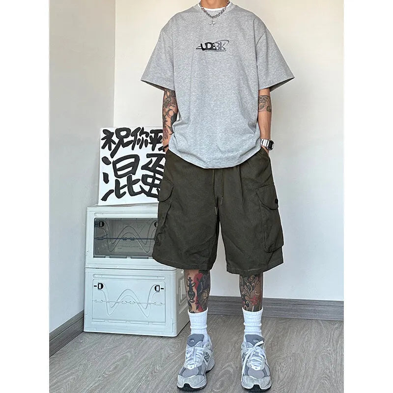 Straight leg sports shorts in loose American casual style available in black, blue, green, or khaki
