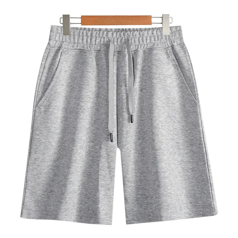 Cotton micro-elastic sports shorts in straight cut fifth length design on hanger