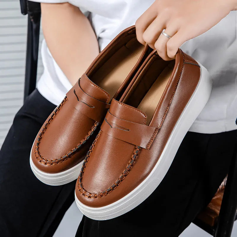 Men's white PU leather slip-on loafers with round toe on a solid background.