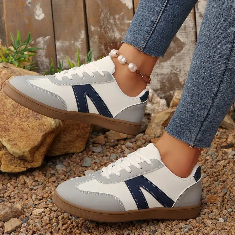 Blue women's low-top lace-up hiking shoes with an artificial PU upper and rubber sole.