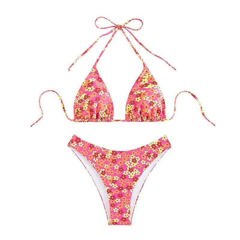 Blue printed women's swimsuit set with lace-up halter neck top and high-waisted side-split shorts.