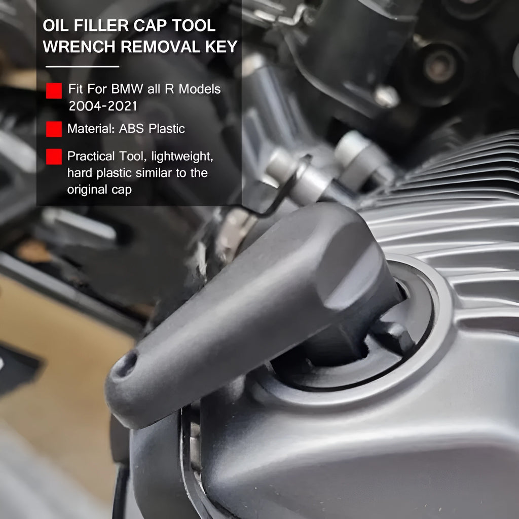 Black nylon quick-release wrench for BMW motorcycle oil cap on a 2004+ R model.
