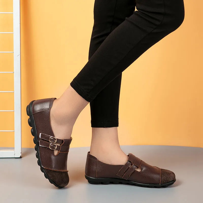 Men's brown leather casual flat shoes with Velcro strap, shown on a white background.