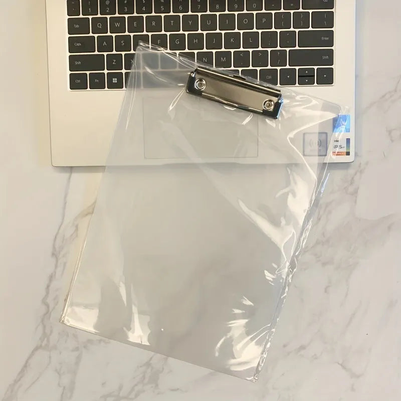 Transparent A4 writing board pad with metal clip holding paper, shown in blue colour variant.
