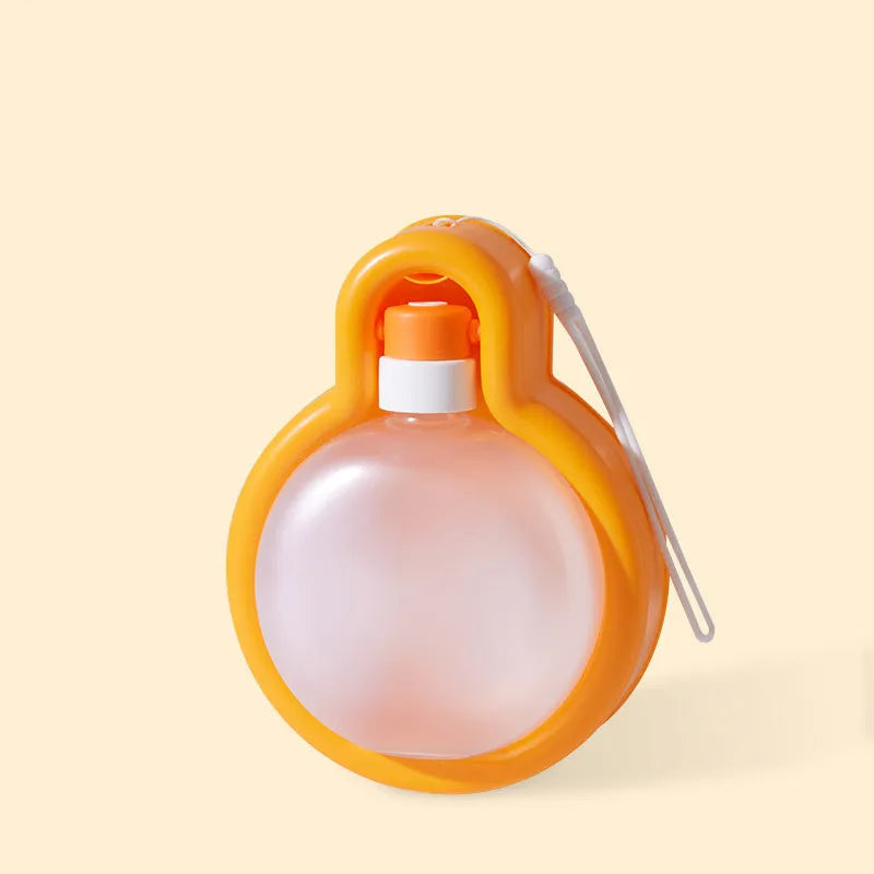 Green portable dog water bottle with integrated drinking bowl for outdoor travel and activities