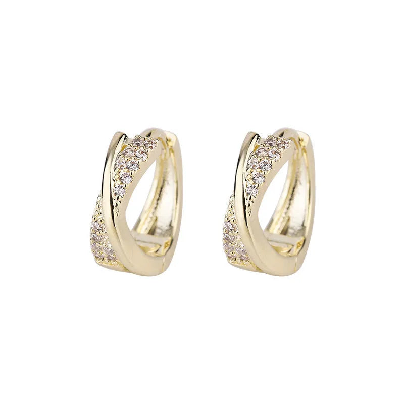 14K yellow geometric copper earrings with zircon accent on white background