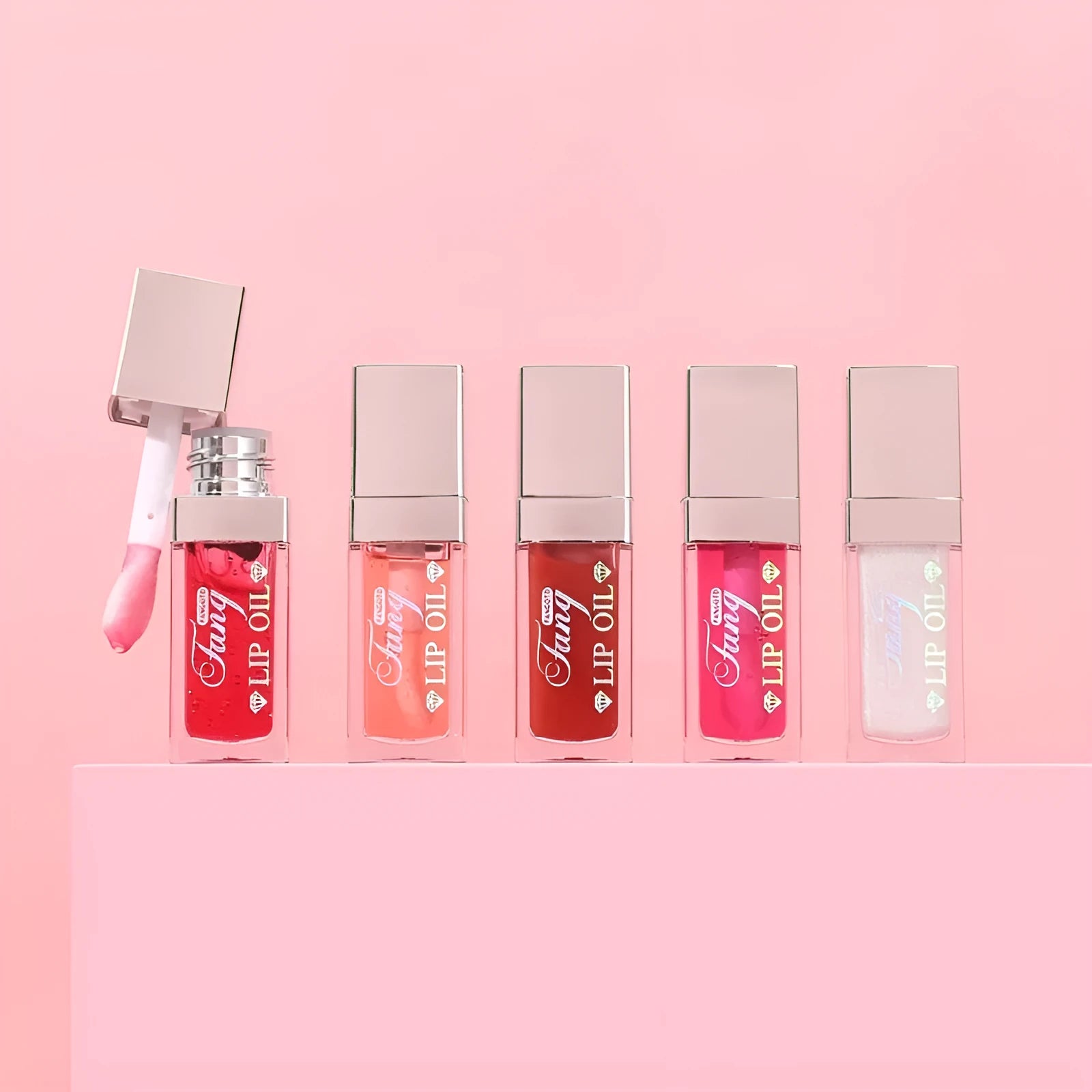 Five tubes of bright lip gloss mint lipstick in shades 001, 006, 007, 012, and 015.