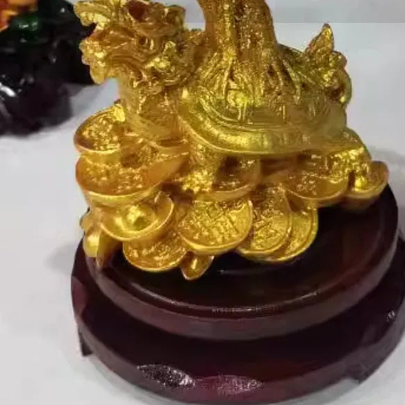 Citrine-coloured Chinese style resin turtle money tree ornament on display.