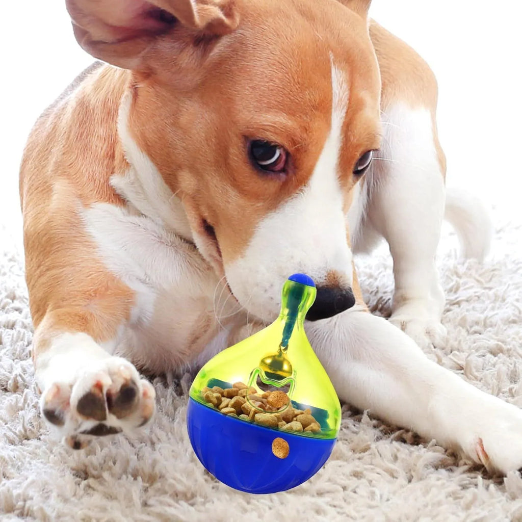 Blue and white durable pet treat dispenser tumbler toy for dogs and cats on a wooden floor.