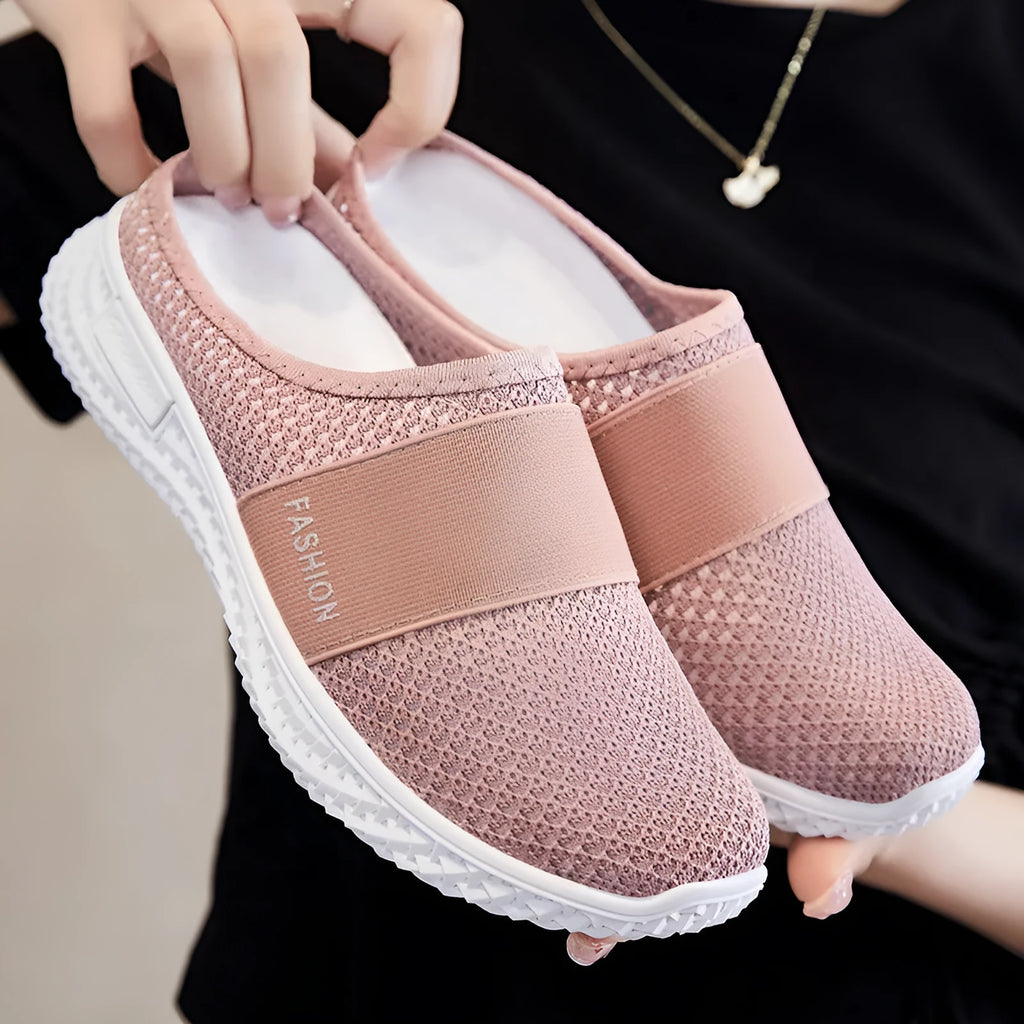 Women's casual shoes with mesh upper and hollow out detailing in round toe shape with flat heel