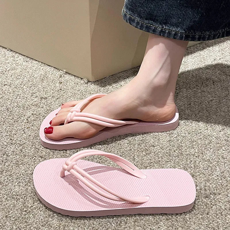 Men's PVC toe covering flip flops in beige on a plain background, showing non-slip sole.