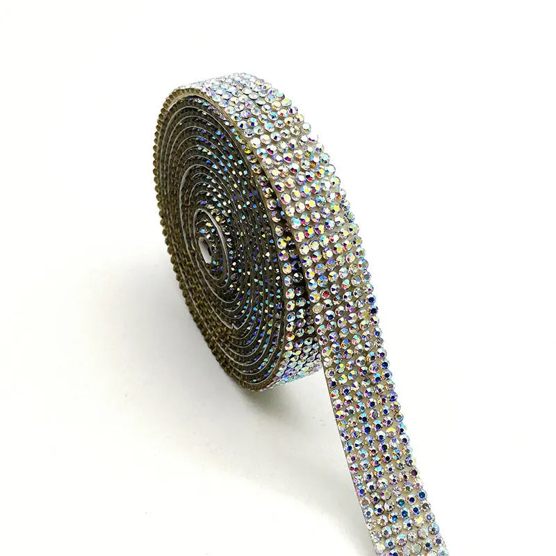 Self-adhesive glass water drill strip on a one-yard reel for shoe and clothing decoration.