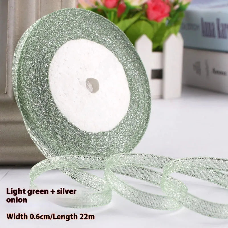 Roll of narrow 0.6cm wide polyester gift wrapping ribbon in assorted colours, showing 22 metre length.