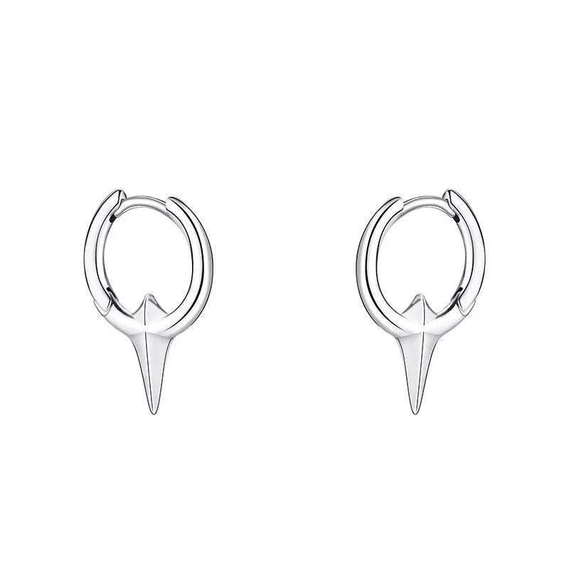A pair of platinum-coloured geometric star-shaped ear clips for women on a white background.
