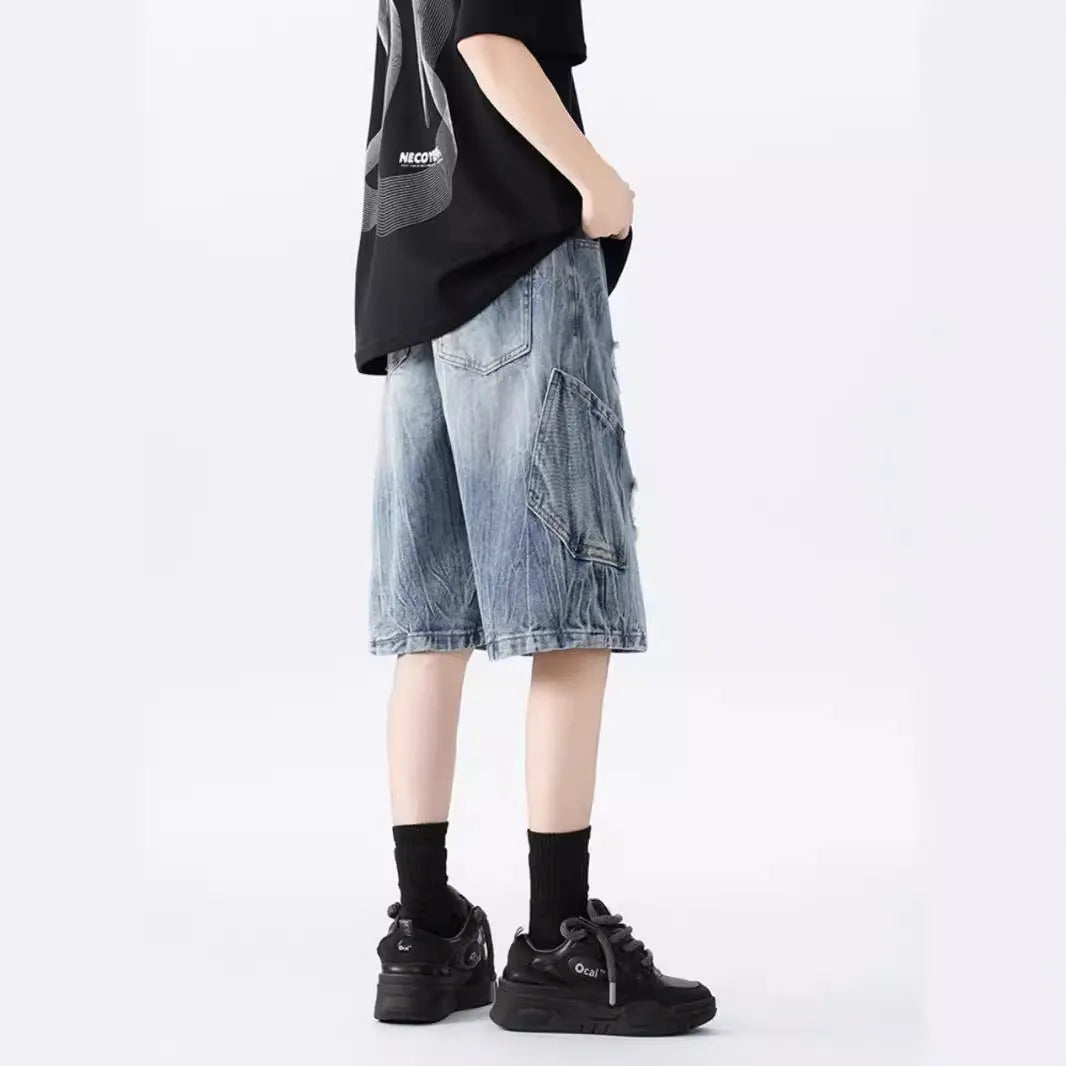 Washed denim shorts with ripped detailing in loose retro fit, black and blue colour options