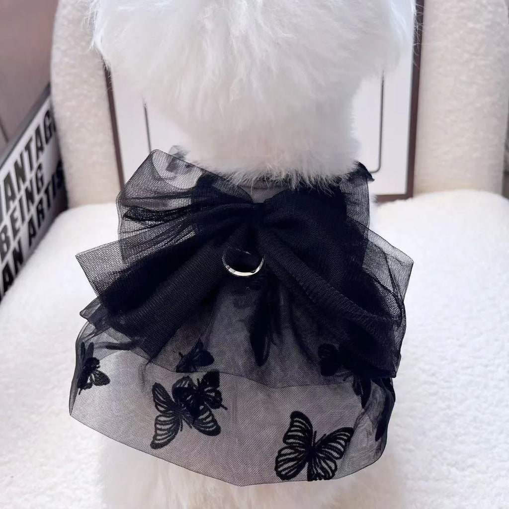 Black polyester tulle princess skirt costume for a small dog or cat on a mannequin, showing the gauzy fabric.