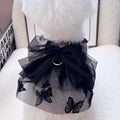 Black polyester tulle princess skirt costume for a small dog or cat on a mannequin, showing the gauzy fabric.
