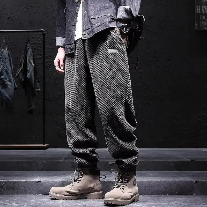 Men's grey ankle strap sweatpants with straight leg cut on mannequin
