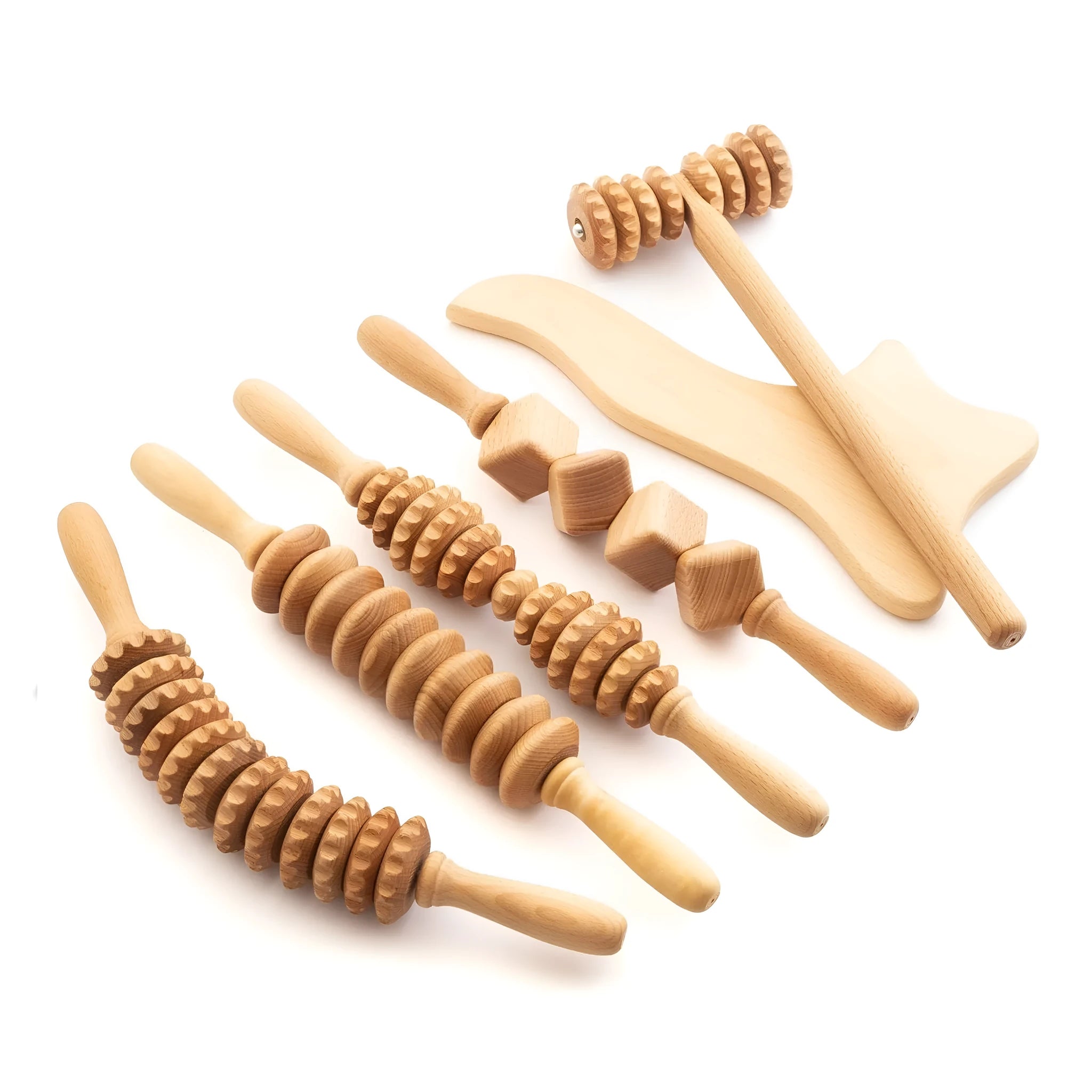 A selection of natural beechwood massage rollers including T-shaped and multi-wheel designs on a wooden surface.