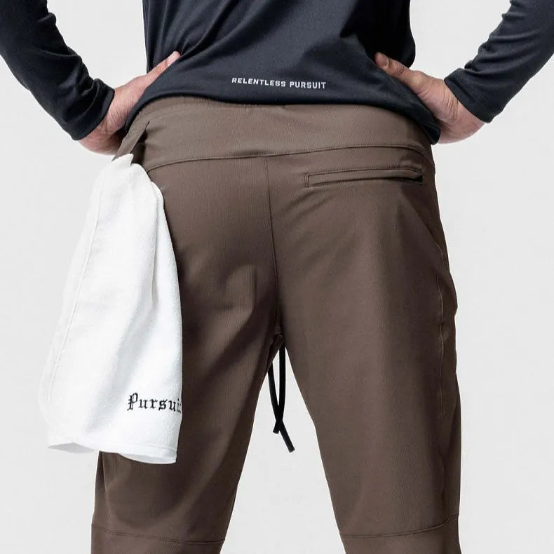 Men's loose grey quick-dry fitness trousers with ankle-tied cuffs for running and gym workouts
