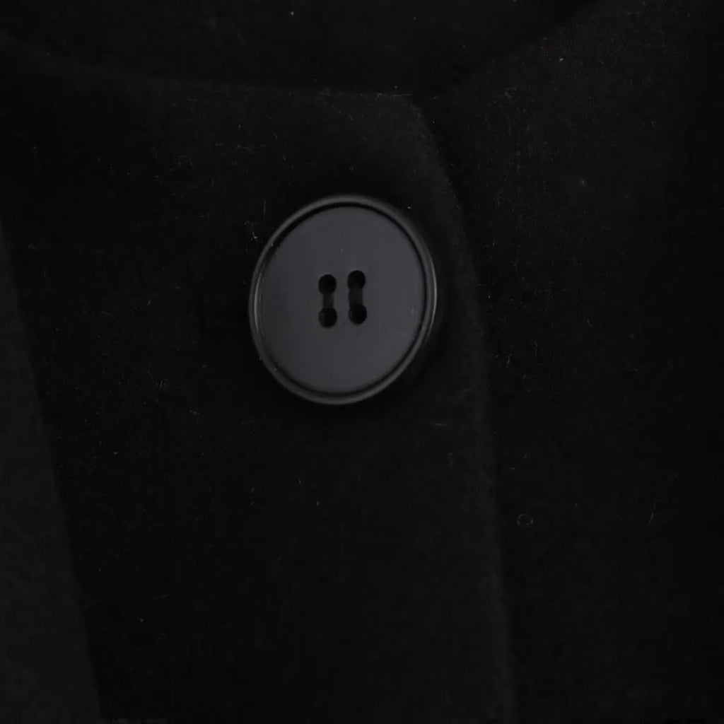 Women's long black polyester overcoat with artificial fur collar, shown at full length.