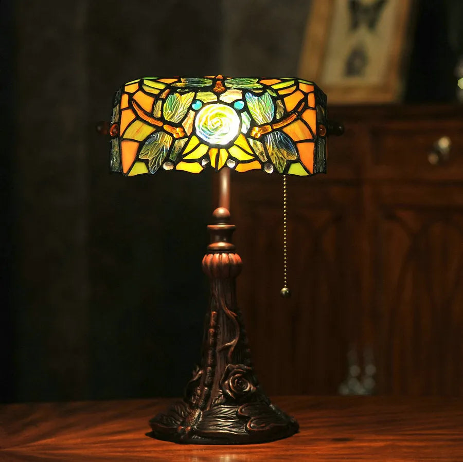 10-inch Tiffany table lamp with coloured stained glass shade and resin base on desk