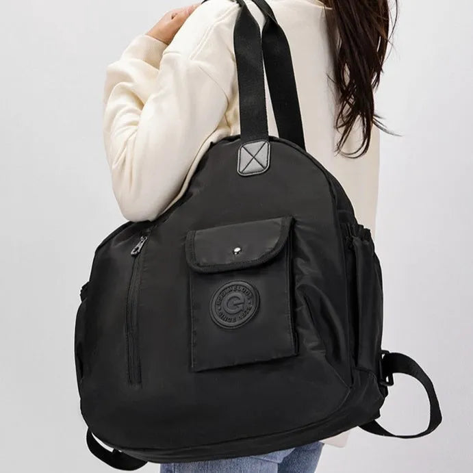 Large lightweight outdoor backpack in black, khaki, or green with rabbit print, showing front sandwich pocket.