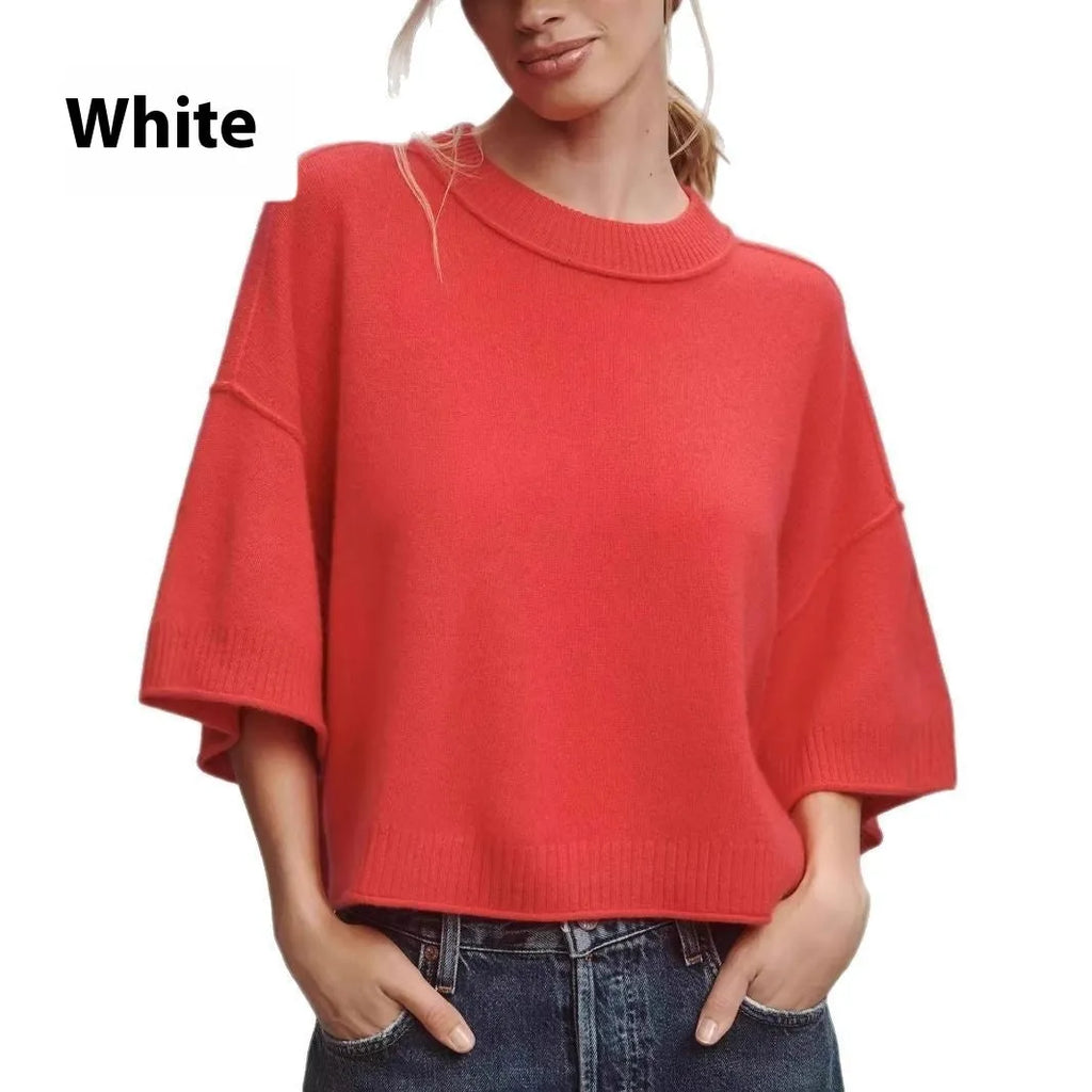 Red women's crop top t-shirt with regular sleeves on a hanger.