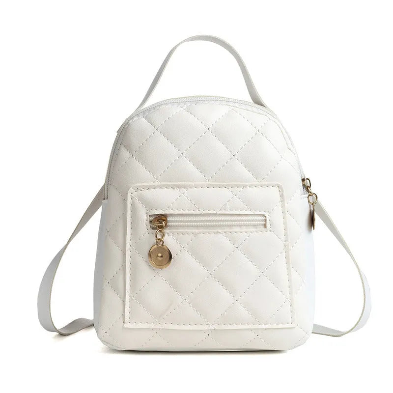 Girls' hard shell backpack with embroidery in black, pink, or white colours showing square shape and sandwich pocket