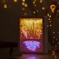 Bedside night light with paper carving design and remote control on wooden nightstand