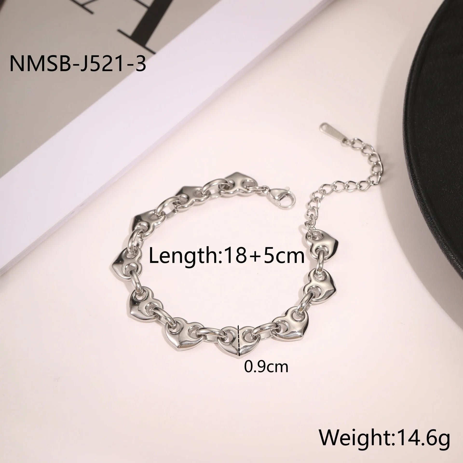 Hollowed-out heart bracelet in stainless steel with 18K gold plating showing simple geometric design